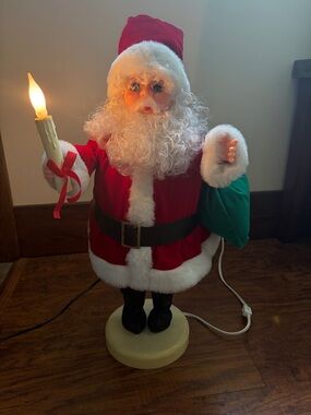 Red Santa with Candle and Green Sack Holiday Figurine